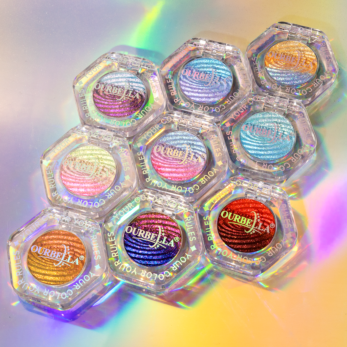Nine OURBELLA Nebula single eyeshadows arranged in clear faceted compacts