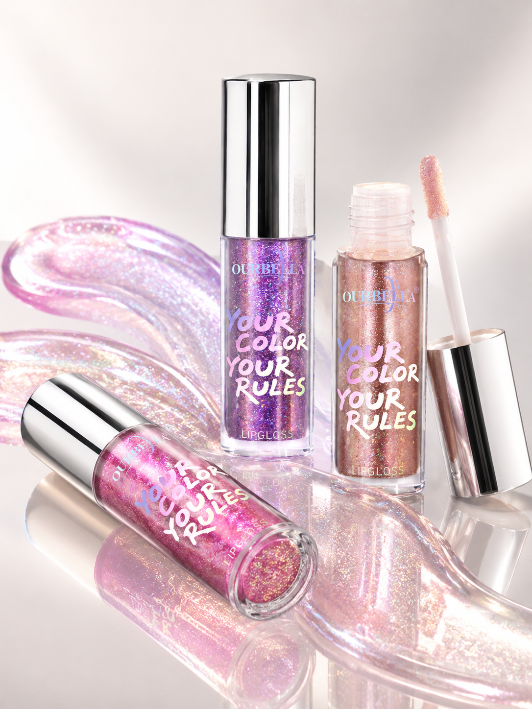 OURBELLA high-shine lip gloss with pink and violet shimmer.